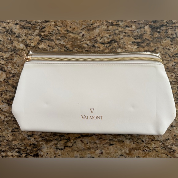 Valmont Handbags - Valmont Cream Cosmetic Bag with Gold Accents